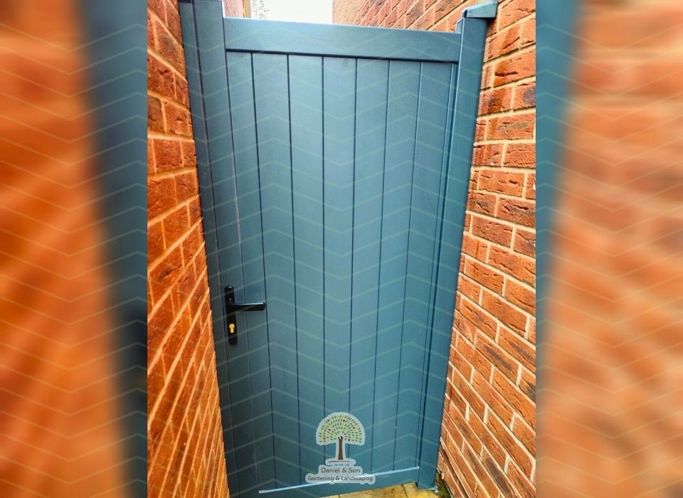 Durable composite gate installed between brick walls

